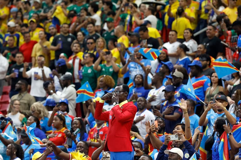 Democratic Republic of Congo's supporter Michel Kuka Mboladinga, pays tribute to Democratic Republic of Congo's late prime minister Patrice Lumumba, by remaining motionless ahead of the 2026 World Cup Group K football match between Colombia and Democratic Republic of Congo at the Guadalajara Stadium in Zapopan on June 23, 2026. (Photo by Ulises RUIZ / AFP)